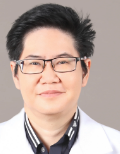 Dr. Kriththa Puengcharoen providing expert medical consultation and patient care.